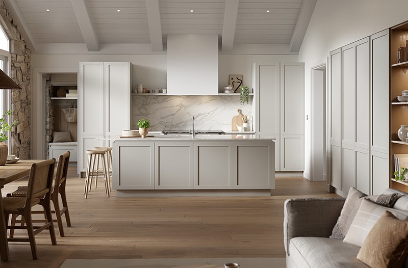 Bright modern kitchen with a large island, wood floors, and neutral-colored cabinets.