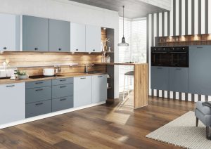 Modern kitchen with blue and gray cabinets, wood accents, and built-in appliances.