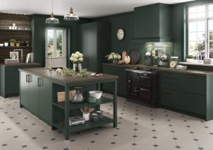 Modern kitchen with green cabinets, island, and large windows letting in natural light.