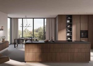 Modern kitchen with wooden cabinets, large island, and dining area by big windows with outdoor view.