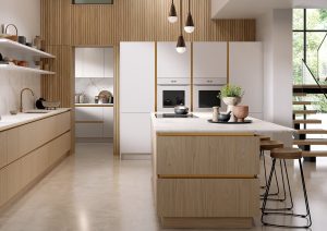 Modern kitchen with light wood cabinets, white countertops, an island, and barstools.